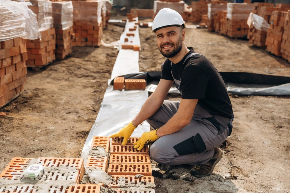 construction worker is at job with bricks outdoors 2025 06 23 08 12 14 utc